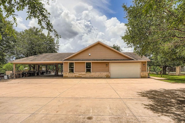 195 Heritage Oaks Dr, Cedar Creek, TX 78612 - single story home featuring concrete driveway, an attached garage, and stone siding