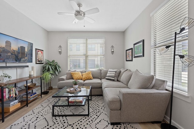 1201 Grove Blvd Unit 2203, Austin, TX 78741 - living area with plenty of natural light, wood finished floors, and ceiling fan
