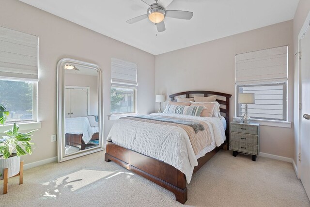 1201 Grove Blvd Unit 2203, Austin, TX 78741 - carpeted bedroom featuring baseboards and ceiling fan