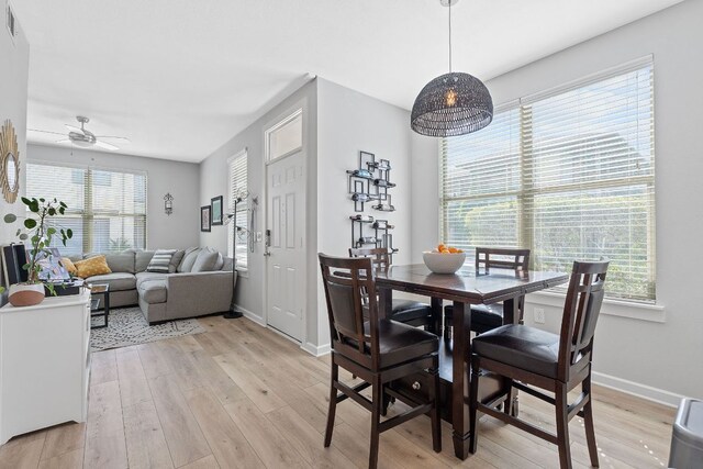 1201 Grove Blvd Unit 2203, Austin, TX 78741 - dining space featuring light wood-style flooring and ceiling fan