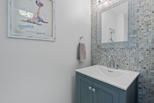1201 Grove Blvd Unit 2203, Austin, TX 78741 - bathroom with vanity and tile walls