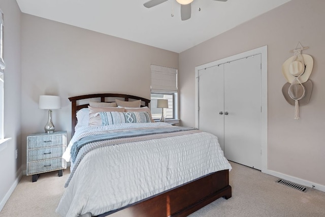 1201 Grove Blvd Unit 2203, Austin, TX 78741 - bedroom featuring carpet floors, a closet, and ceiling fan