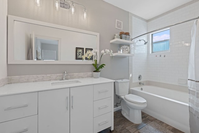 1201 Grove Blvd Unit 2203, Austin, TX 78741 - full bathroom featuring vanity, shower / bath combo with shower curtain, and wood finished floors