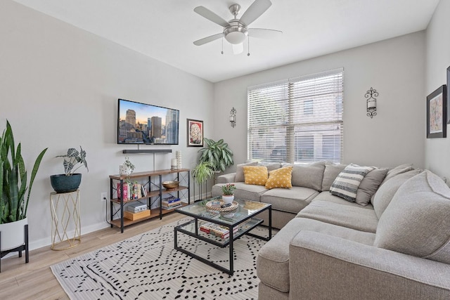 1201 Grove Blvd Unit 2203, Austin, TX 78741 - living room with light wood-style floors and ceiling fan