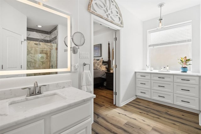 4539 Miraval Loop, Round Rock, TX 78665 - bathroom with ensuite bath, vanity, a shower stall, and wood finished floors