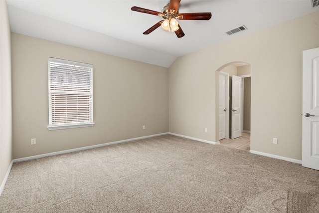 4539 Miraval Loop, Round Rock, TX 78665 - unfurnished room featuring arched walkways, light carpet, a ceiling fan, and vaulted ceiling