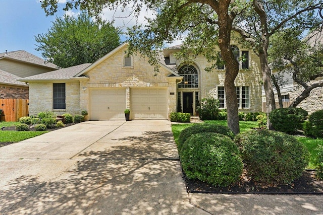 1224 Fall Creek Loop, Cedar Park, TX 78613 - view of front of house with stone siding, driveway, and a garage