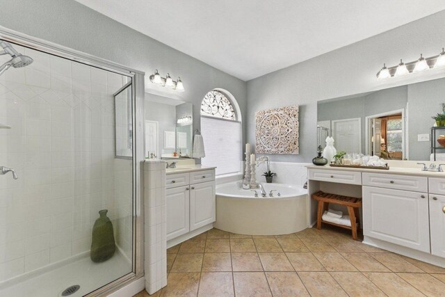 1224 Fall Creek Loop, Cedar Park, TX 78613 - full bathroom featuring a shower stall, vanity, a bath, and healthy amount of natural light