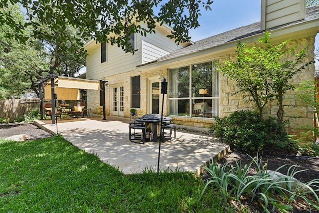 1224 Fall Creek Loop, Cedar Park, TX 78613 - back of house featuring stone siding, a patio, and french doors