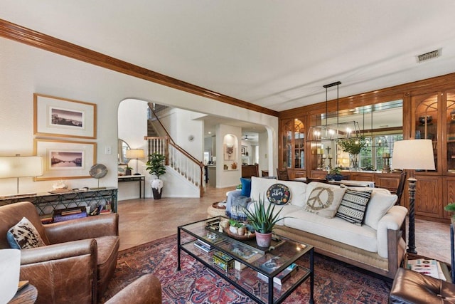 1224 Fall Creek Loop, Cedar Park, TX 78613 - tiled living room featuring stairs, ornamental molding, a chandelier, and arched walkways