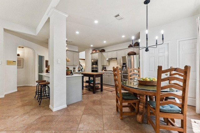 1224 Fall Creek Loop, Cedar Park, TX 78613 - dining space featuring arched walkways, a chandelier, light tile patterned floors, and recessed lighting