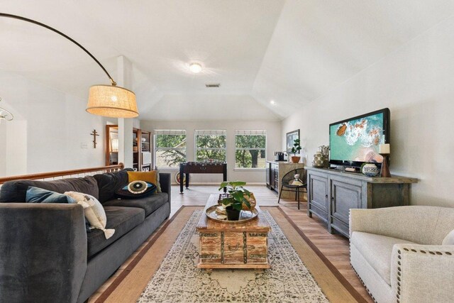 1224 Fall Creek Loop, Cedar Park, TX 78613 - living area featuring vaulted ceiling and light wood-style floors