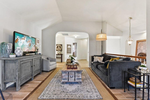 1224 Fall Creek Loop, Cedar Park, TX 78613 - living area featuring lofted ceiling, light wood finished floors, and arched walkways