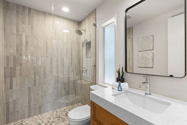 701 Terrace Mountain Dr, West Lake Hills, TX 78746 - bathroom with vanity, a tile shower, and recessed lighting