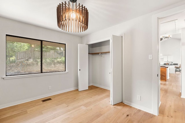 701 Terrace Mountain Dr, West Lake Hills, TX 78746 - unfurnished bedroom featuring wood finished floors and a closet