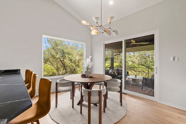 701 Terrace Mountain Dr, West Lake Hills, TX 78746 - dining area featuring a chandelier, high vaulted ceiling, and light wood-style flooring