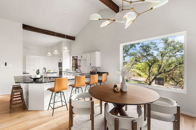 701 Terrace Mountain Dr, West Lake Hills, TX 78746 - dining room with high vaulted ceiling, beam ceiling, light wood-style floors, and a chandelier