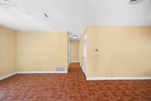 7923 Brockman St, Austin, TX 78757 - tiled spare room with a textured ceiling and baseboards