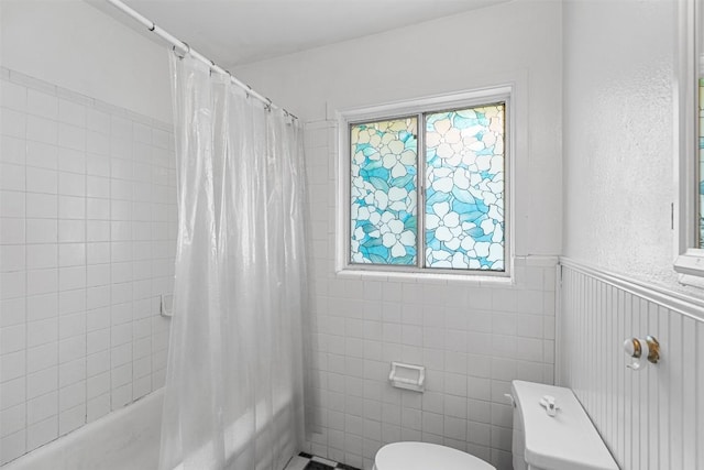 7923 Brockman St, Austin, TX 78757 - bathroom featuring shower / bath combo and wainscoting