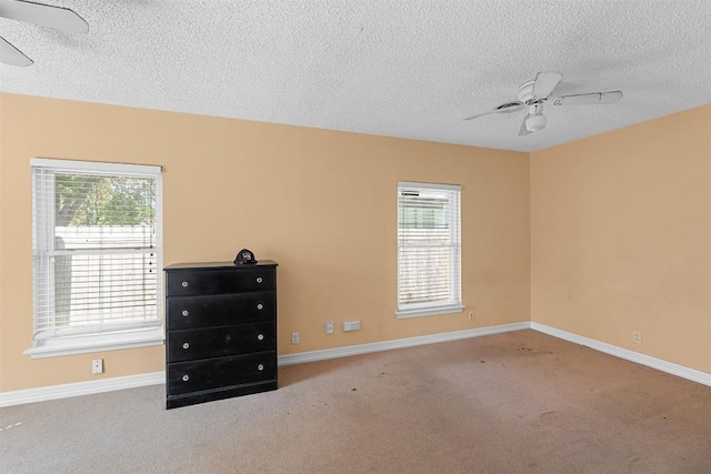 7923 Brockman St, Austin, TX 78757 - spare room with ceiling fan, a textured ceiling, carpet floors, and healthy amount of natural light