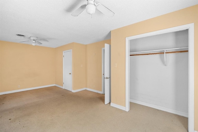 7923 Brockman St, Austin, TX 78757 - unfurnished bedroom featuring light carpet, a closet, a textured ceiling, and a ceiling fan