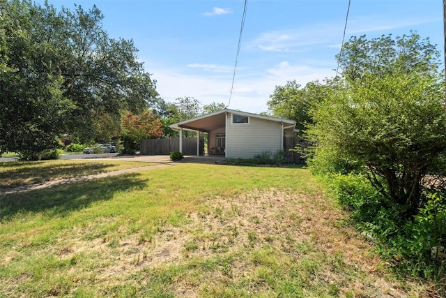 7923 Brockman St, Austin, TX 78757 - view of yard featuring an attached carport and driveway