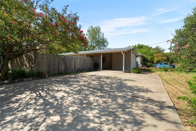 7923 Brockman St, Austin, TX 78757 - view of home's exterior with driveway and a carport