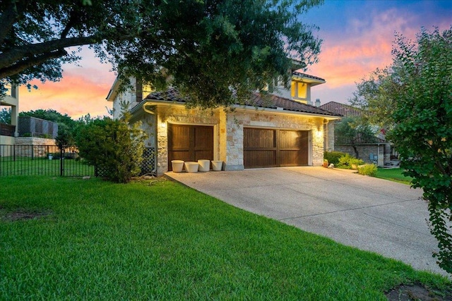 view of front of house with stone siding, concrete driveway, and a garage