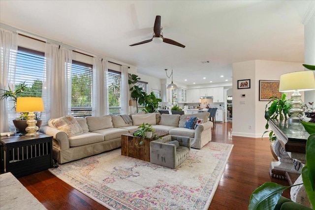living area featuring a ceiling fan, dark wood-style floors, and recessed lighting