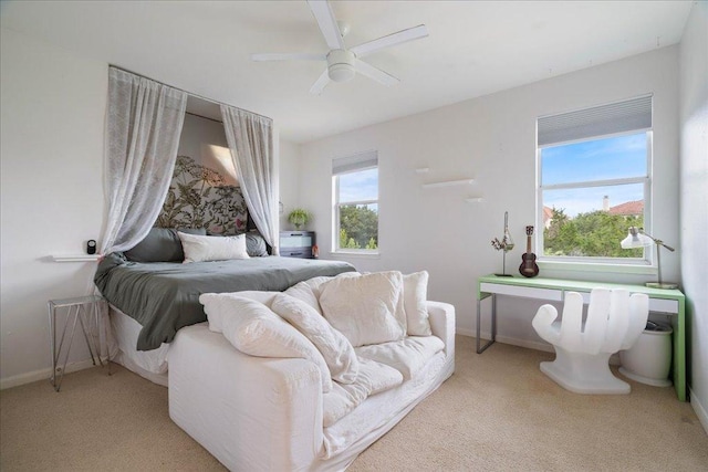 bedroom with light colored carpet and ceiling fan