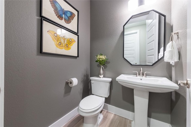4644 Arques Ave, Round Rock, TX 78681 - bathroom featuring wood finished floors and toilet