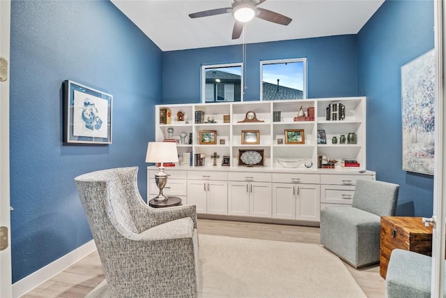 4644 Arques Ave, Round Rock, TX 78681 - living area with ceiling fan and light wood-style flooring