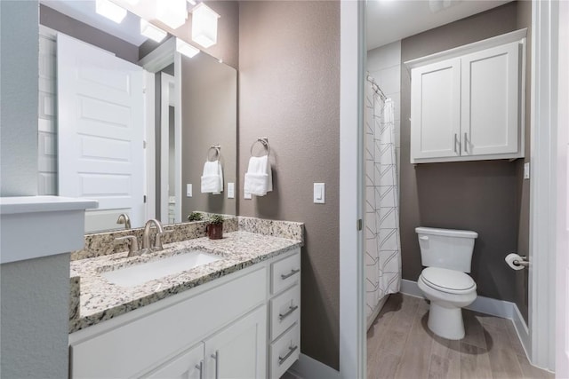 4644 Arques Ave, Round Rock, TX 78681 - bathroom featuring vanity, wood finished floors, and a shower with curtain