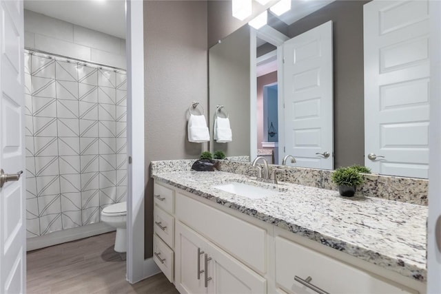 4644 Arques Ave, Round Rock, TX 78681 - full bathroom with vanity, wood finished floors, and curtained shower