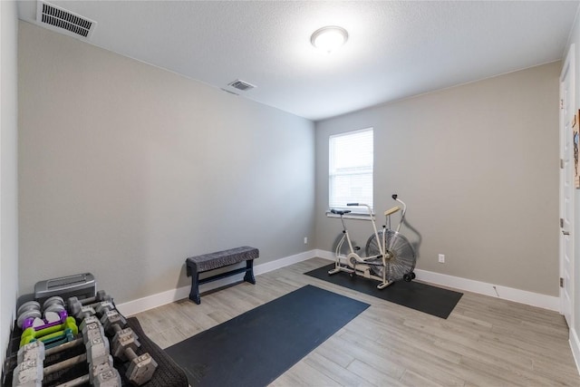 4644 Arques Ave, Round Rock, TX 78681 - exercise room featuring wood finished floors