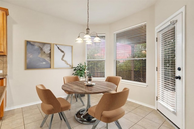 36 White Magnolia Cir, Austin, TX 78734 - dining room with a chandelier and light tile patterned floors