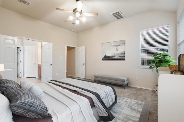 36 White Magnolia Cir, Austin, TX 78734 - bedroom with light colored carpet, vaulted ceiling, and ceiling fan