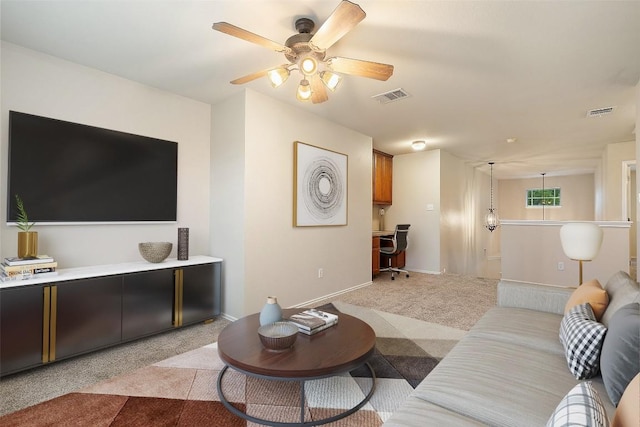 36 White Magnolia Cir, Austin, TX 78734 - living room with light carpet, ceiling fan, and built in study area