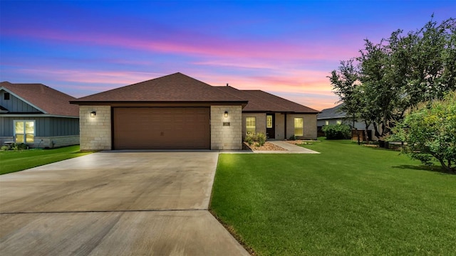 208 Rachel Loop, Burnet, TX 78611 - ranch-style house featuring concrete driveway, a front yard, a shingled roof, and an attached garage