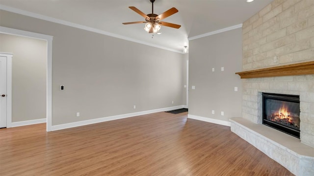 208 Rachel Loop, Burnet, TX 78611 - unfurnished living room with crown molding, ceiling fan, a fireplace, and wood finished floors
