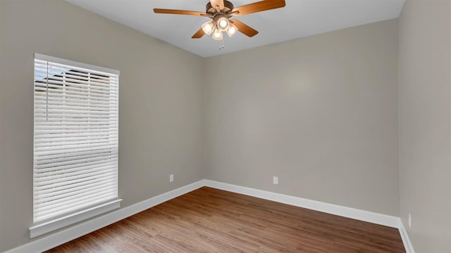 208 Rachel Loop, Burnet, TX 78611 - empty room with wood finished floors and ceiling fan