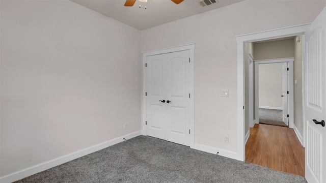 208 Rachel Loop, Burnet, TX 78611 - unfurnished bedroom with carpet, ceiling fan, and a closet