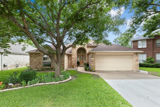 1212 Dove Cir, Cedar Park, TX 78613 - view of front facade with a garage, driveway, a front yard, and brick siding