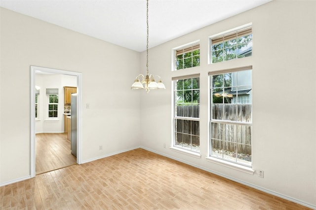 1212 Dove Cir, Cedar Park, TX 78613 - empty room featuring a chandelier and light wood-style flooring