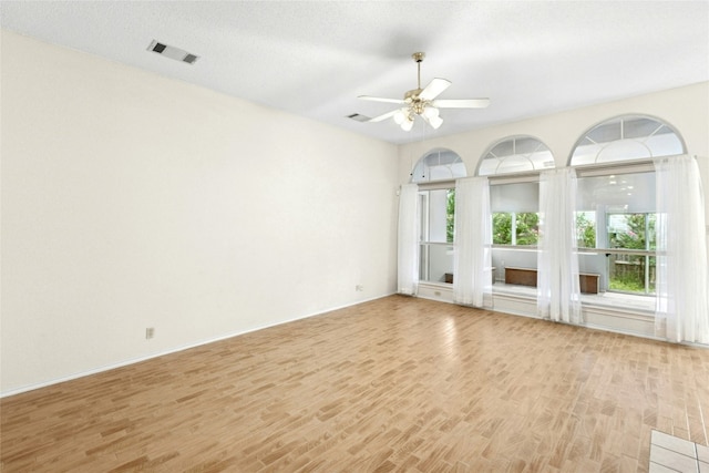 1212 Dove Cir, Cedar Park, TX 78613 - spare room with light wood finished floors and a ceiling fan