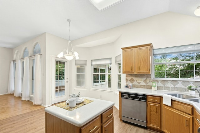 1212 Dove Cir, Cedar Park, TX 78613 - kitchen with stainless steel dishwasher, light wood-type flooring, a chandelier, healthy amount of natural light, and vaulted ceiling
