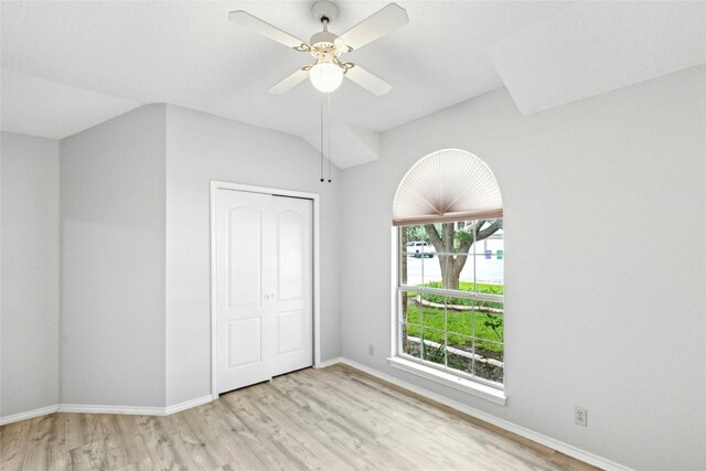 1212 Dove Cir, Cedar Park, TX 78613 - unfurnished bedroom featuring light wood-type flooring, a closet, a ceiling fan, and lofted ceiling