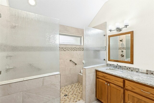 1212 Dove Cir, Cedar Park, TX 78613 - full bathroom with a walk in shower, lofted ceiling, and vanity