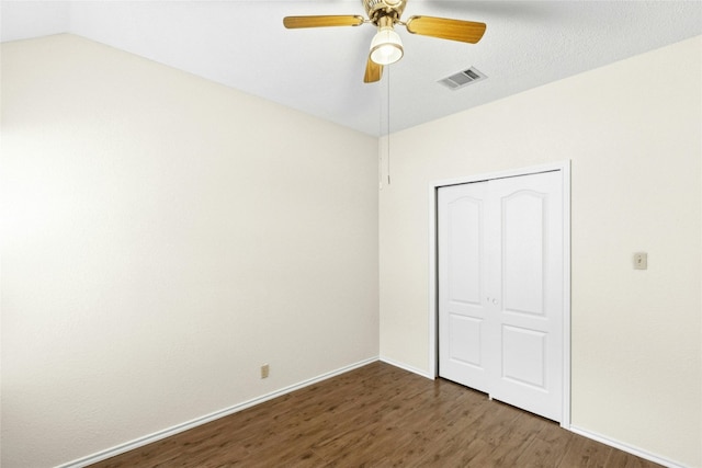 1212 Dove Cir, Cedar Park, TX 78613 - unfurnished bedroom featuring wood finished floors, a closet, vaulted ceiling, and ceiling fan