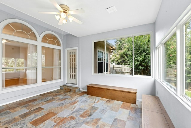 1212 Dove Cir, Cedar Park, TX 78613 - unfurnished sunroom with stone finish flooring and plenty of natural light